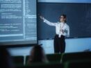 A Lady Trainer Explains The Data Science Concept In A Big Screen